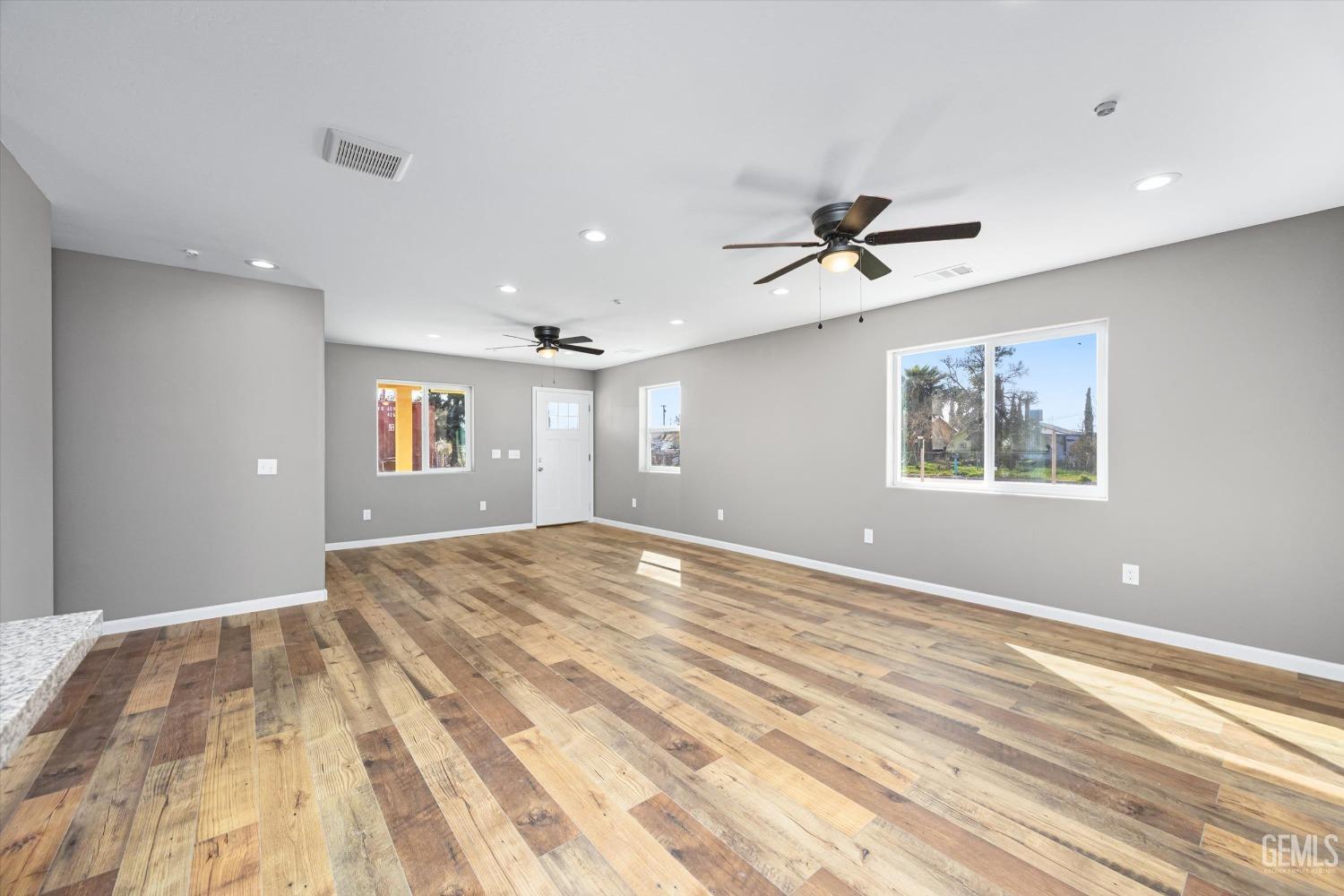 Undisclosed Address Bakersfield, CA 93307 - Photo 7 of 22 a view of an empty room with a window
