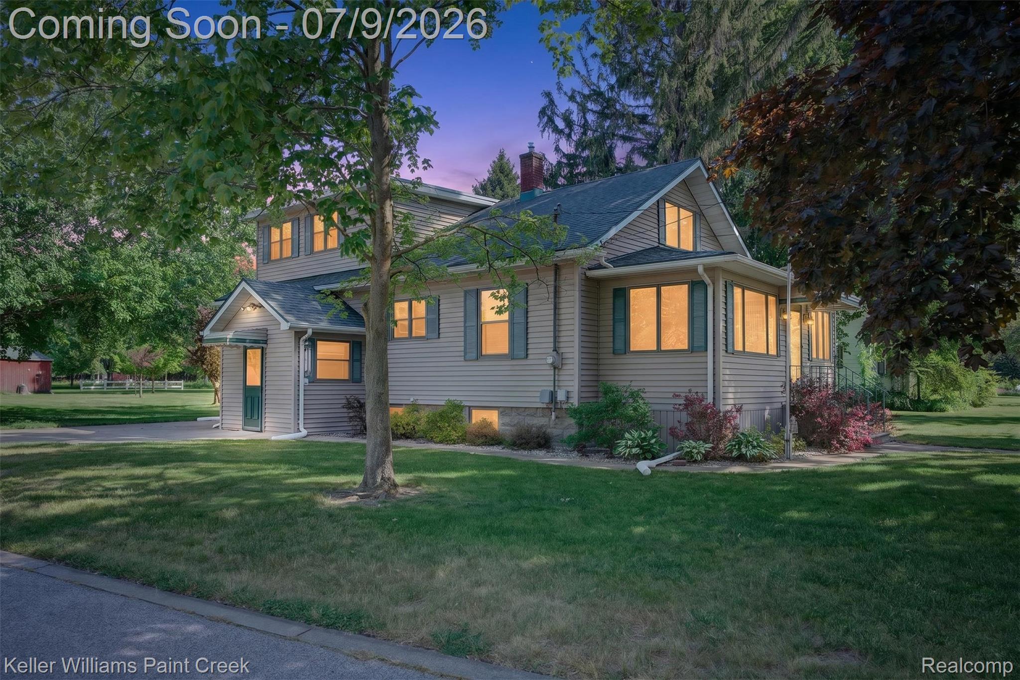 204 Russell Road Kawkawlin, MI 48631 - Photo 71 of 82 Traditional-style residence featuring light-colored siding and a dark green shingled roof