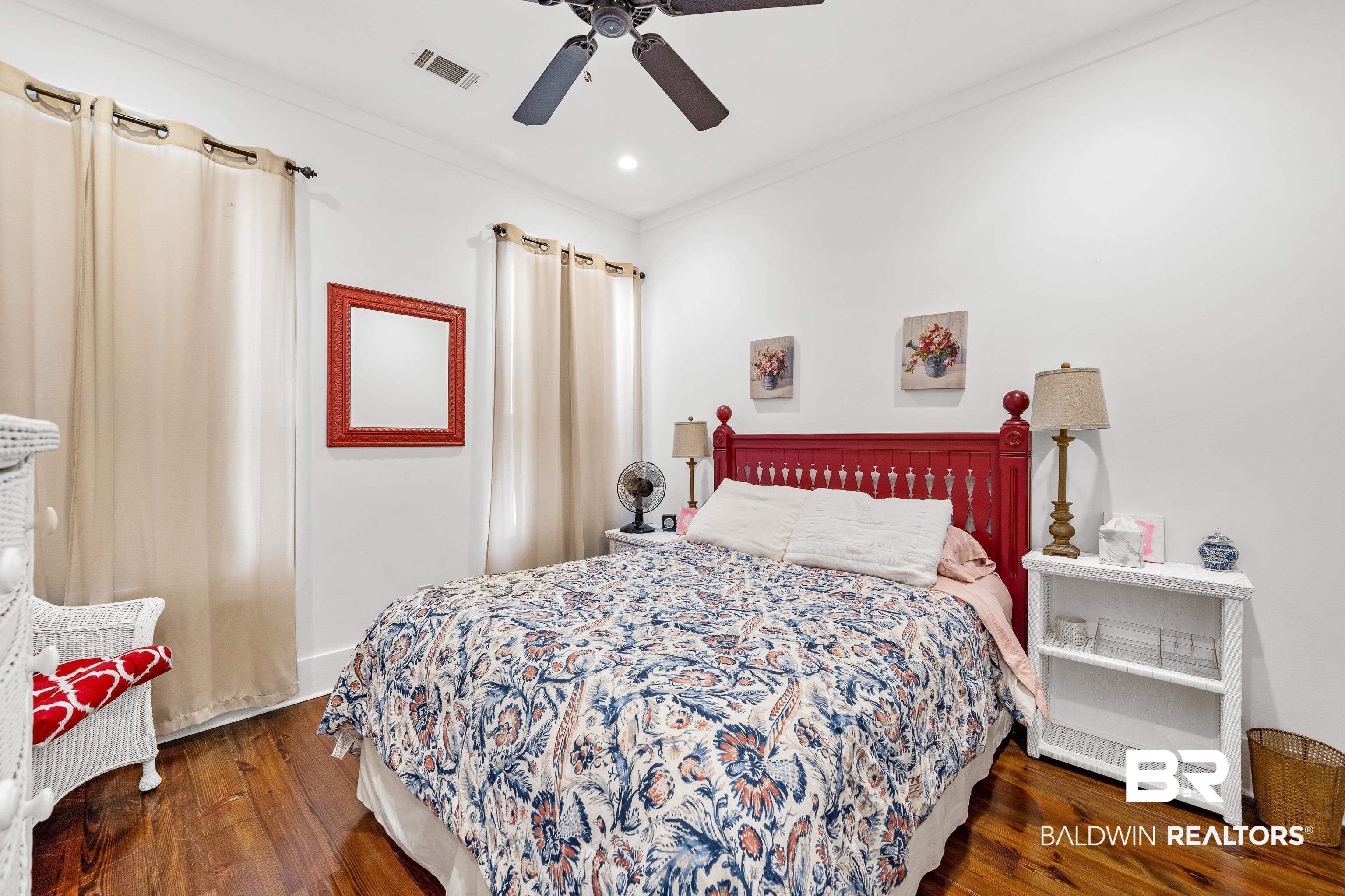 25773 Canal Road, Unit 10 Orange Beach, AL 36561 - Photo 23 of 40 Bedroom with dark hardwood / wood-style flooring, ceiling fan, and ornamental molding