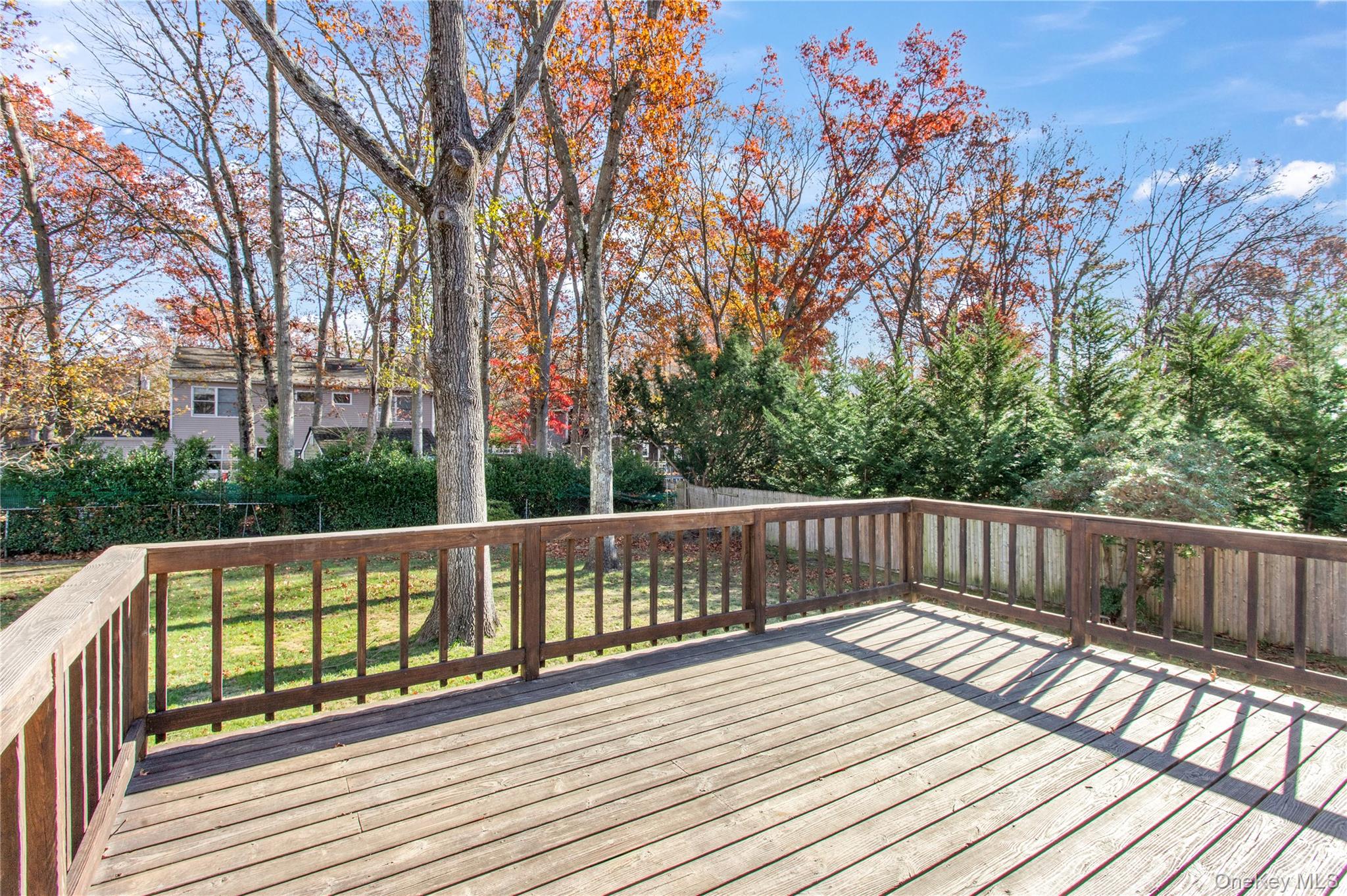 11 Seneca Trail Ridge, NY 11961 - Photo 9 of 10 a view of balcony with wooden floor and fence