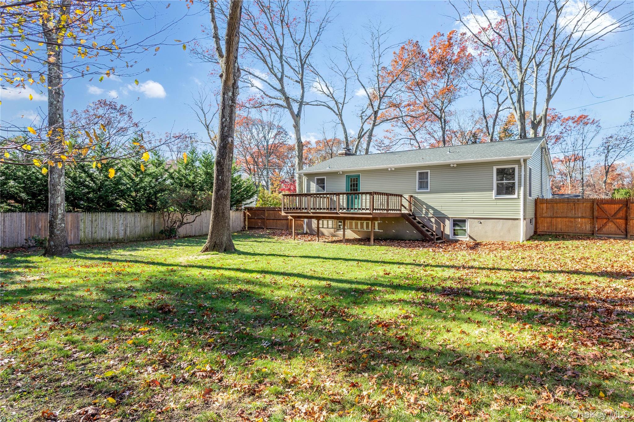 11 Seneca Trail Ridge, NY 11961 - Photo 10 of 10 a front view of a house with a yard and trees