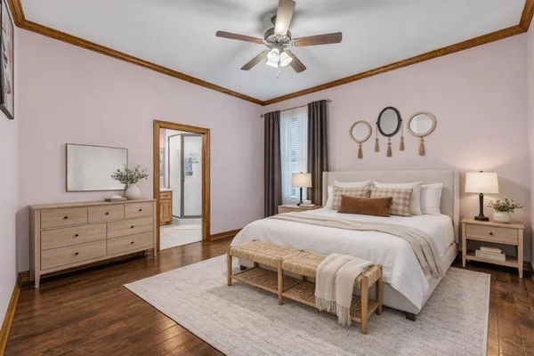 a spacious bedroom with a bed and a dresser