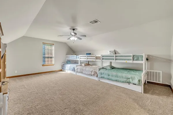 a view of a room with furniture and chandelier