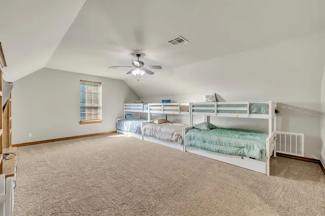 a view of a room with furniture and chandelier