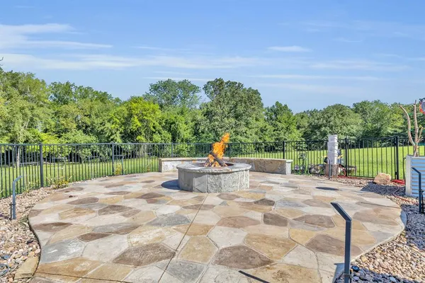 a view of a backyard with sitting area