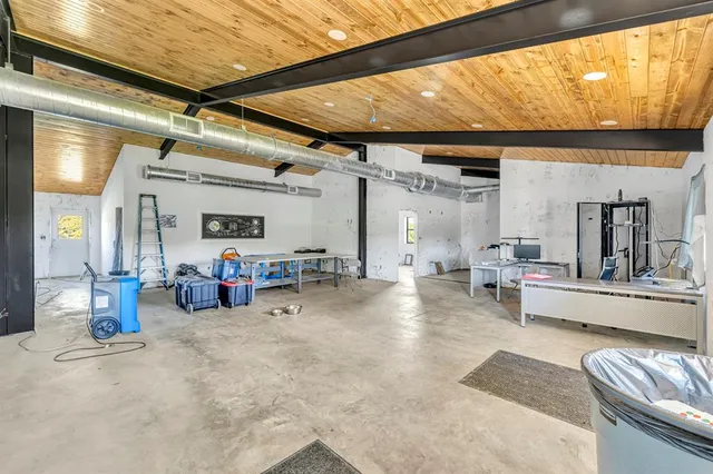 a view of a livingroom with furniture and a window