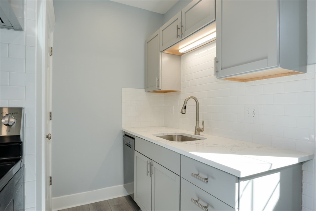 47 Mechanic Street, Unit 1 Marlborough, MA 01752 - Photo 12 of 26 a bathroom with a sink and a mirror