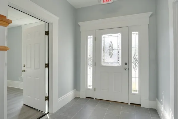 a view of an entryway with wooden floor