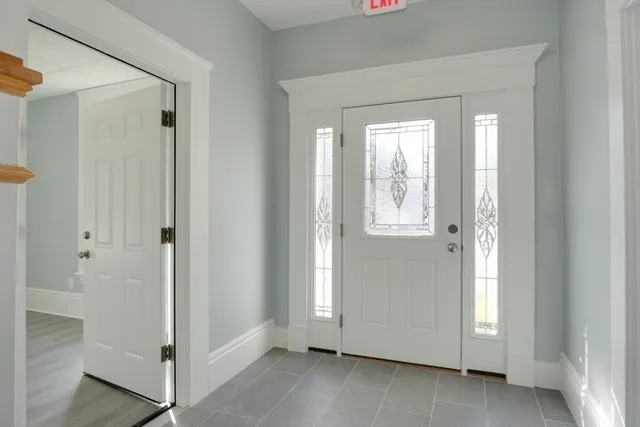 a view of an entryway with wooden floor