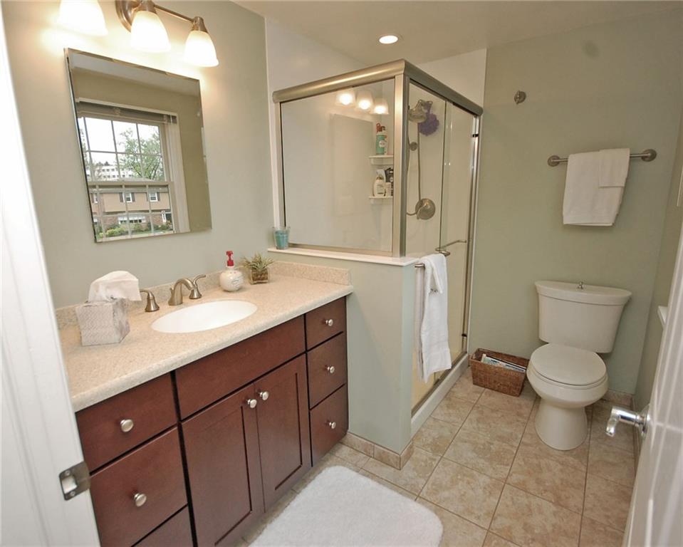575 Miranda Road Pittsburgh, PA 15241 - Photo 12 of 24 Master bathroom was updated and enlarged with newer flooring, vanity, shower, toilet and lighting.
