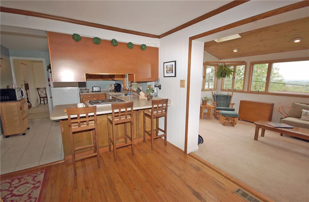 575 Miranda Road Pittsburgh, PA 15241 - Photo 7 of 24 Kitchen is open to family room and sun room is around the corner.