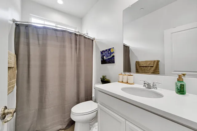 a bedroom with a bed and a table in it