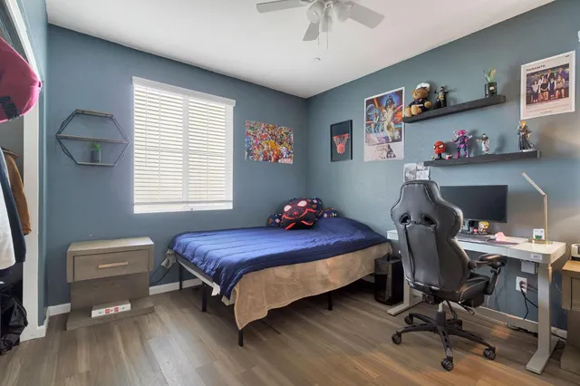 a bedroom with a bed and window