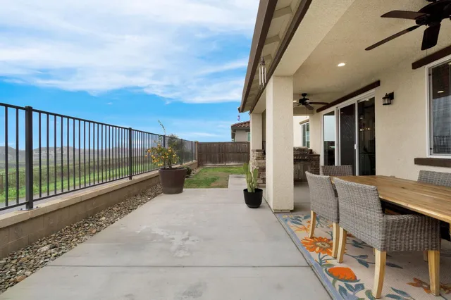 a front view of a multi story residential apartment building with yard