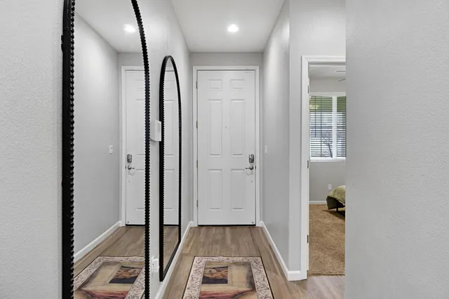 a view of a bathroom from the hallway