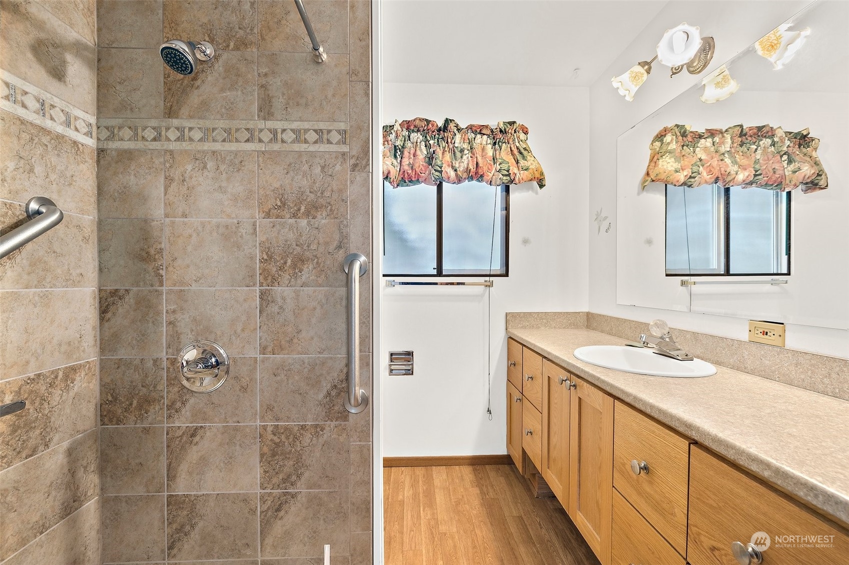 14530 Southeast 112th Place Renton, WA 98059 - Photo 16 of 34 a bathroom with double vanity sink and a mirror