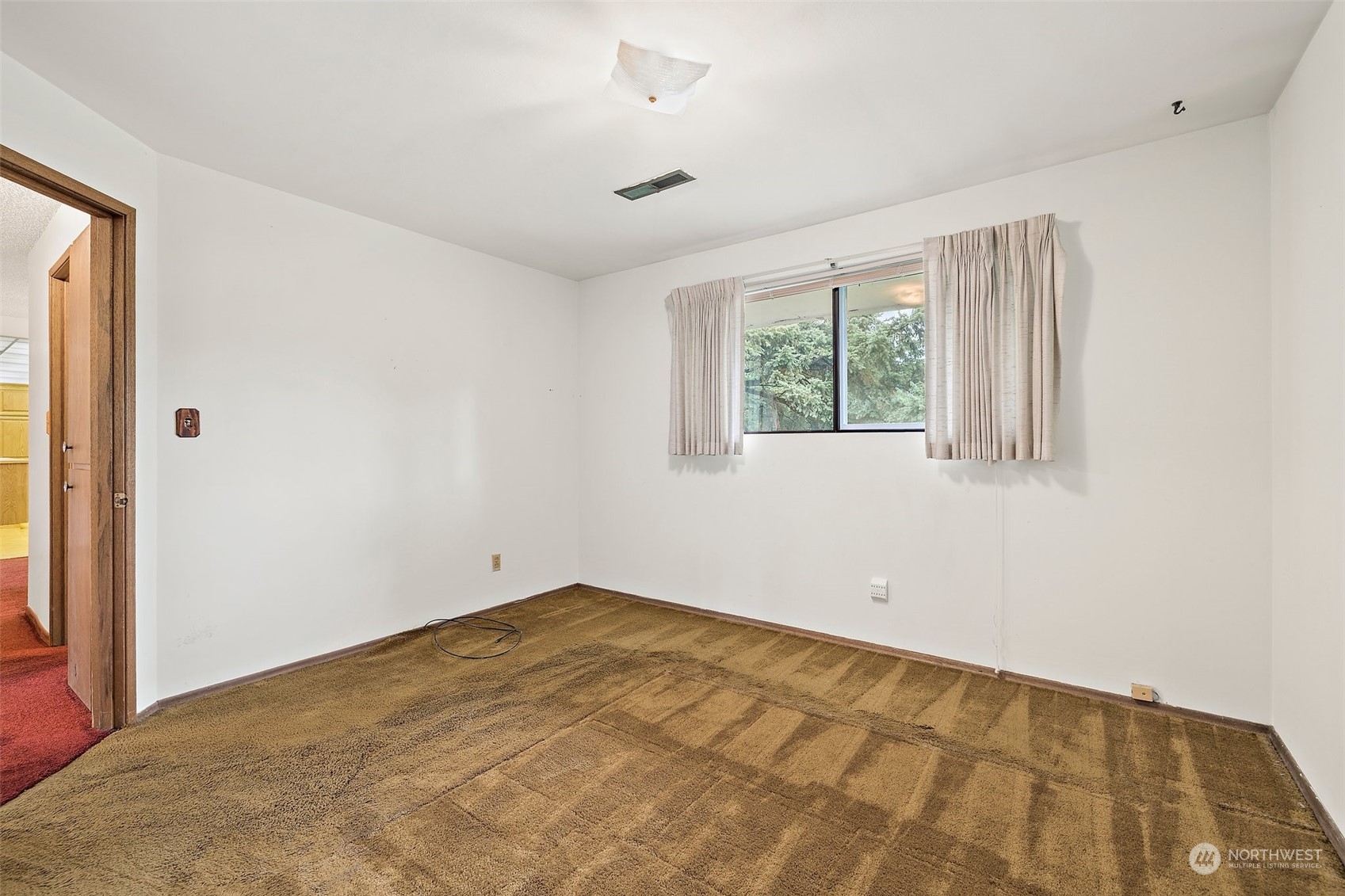 14530 Southeast 112th Place Renton, WA 98059 - Photo 17 of 34 an empty room with a window