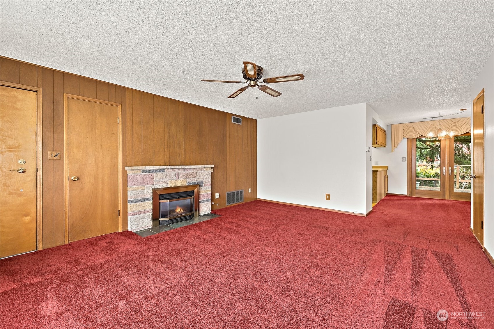 14530 Southeast 112th Place Renton, WA 98059 - Photo 2 of 34 a view of empty room with fireplace