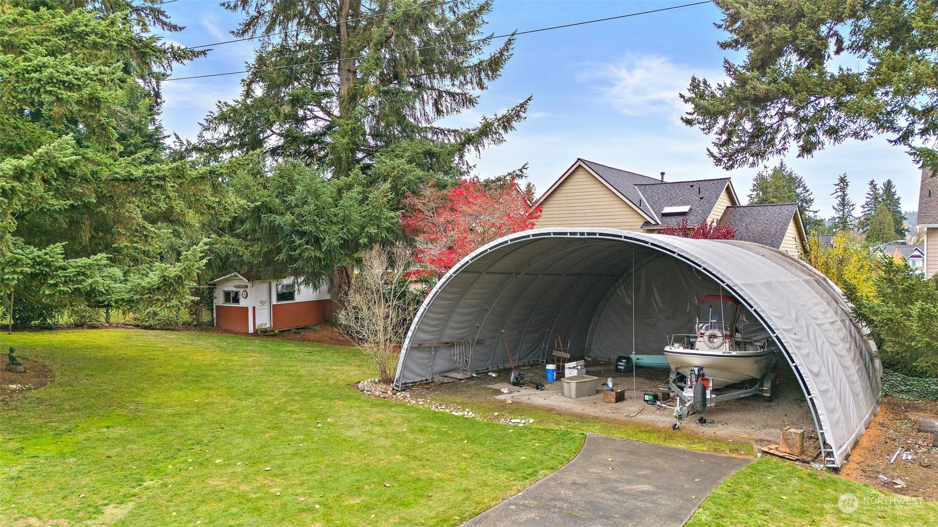 14530 Southeast 112th Place Renton, WA 98059 - Photo 28 of 34 a view of a chair and table in the patio with a yard