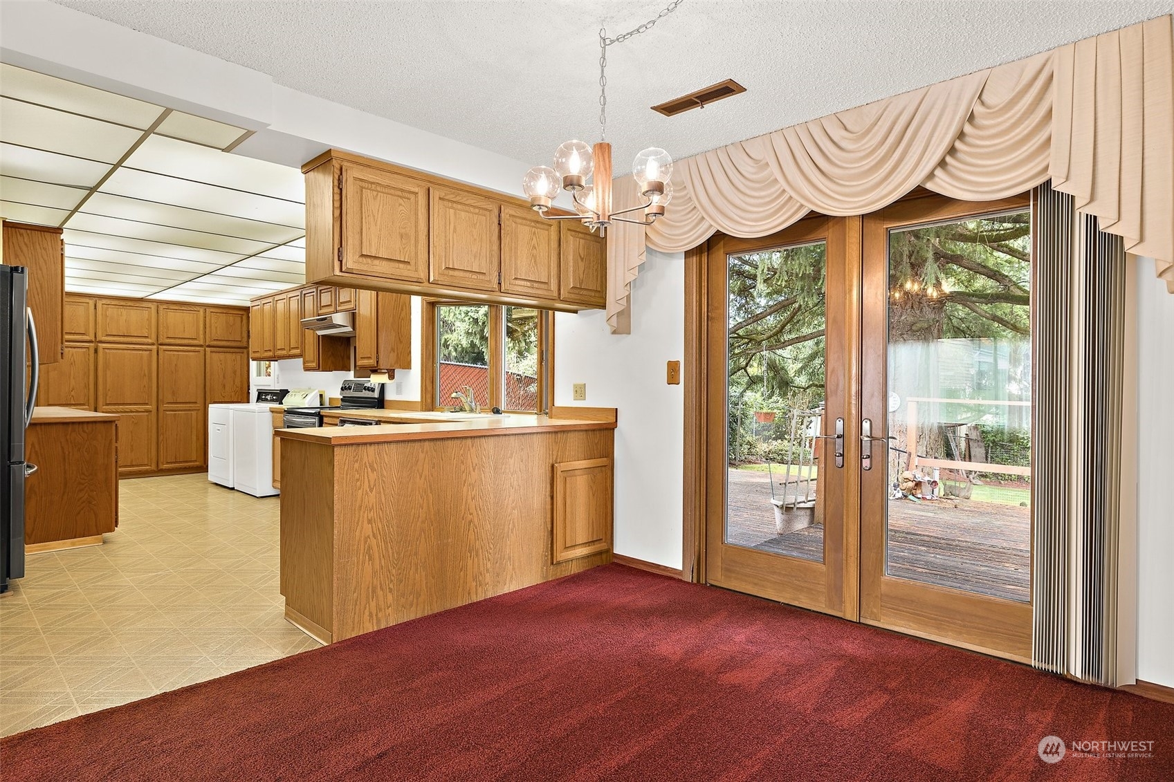 14530 Southeast 112th Place Renton, WA 98059 - Photo 5 of 34 a view of kitchen with furniture and wooden floor