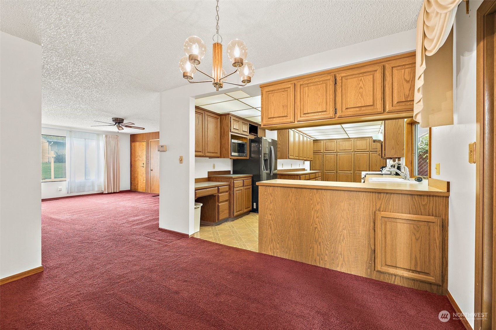 14530 Southeast 112th Place Renton, WA 98059 - Photo 6 of 34 a kitchen with refrigerator cabinets and a kitchen