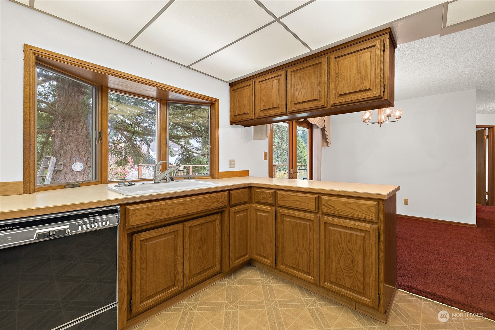14530 Southeast 112th Place Renton, WA 98059 - Photo 8 of 34 a kitchen with stainless steel appliances granite countertop a sink and cabinets