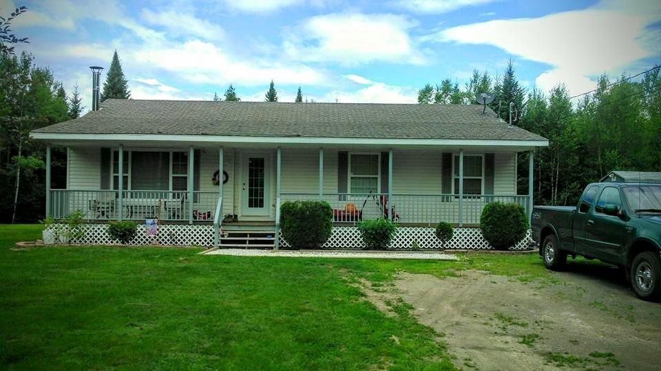 View of front of house in the summer
