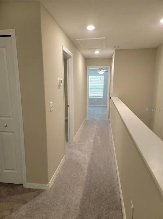 14308 Easy Goer Street Ruskin, FL 33573 - Photo 5 of 14 a view of hallway with stairs