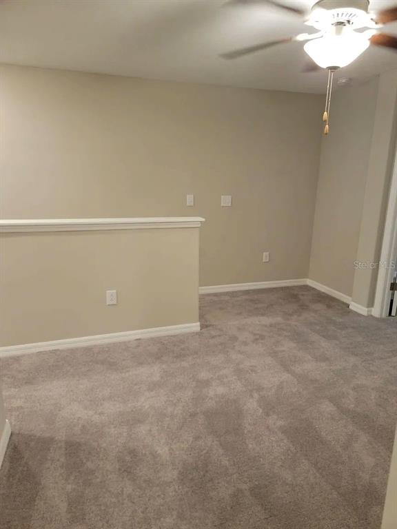 14308 Easy Goer Street Ruskin, FL 33573 - Photo 6 of 14 a view of an empty room
