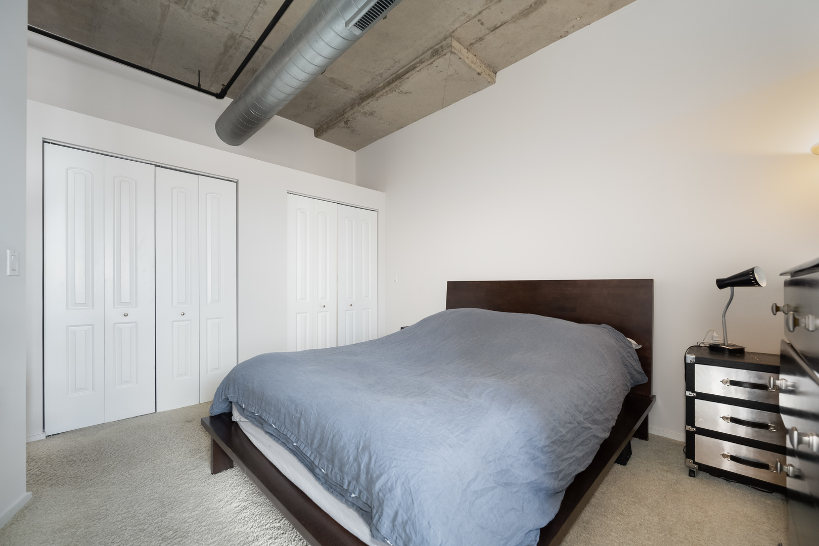 6 South Laflin Street, Unit 722 Chicago, IL 60607 - Photo 11 of 16 a bedroom with a bed and a cabinets