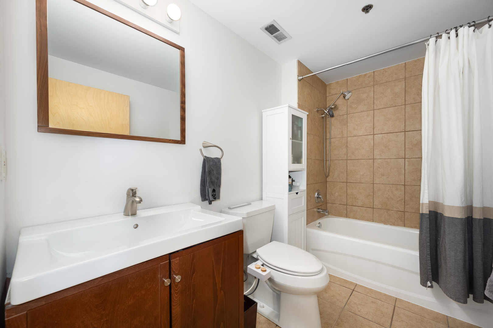 6 South Laflin Street, Unit 722 Chicago, IL 60607 - Photo 13 of 16 a bathroom with a sink a toilet and shower