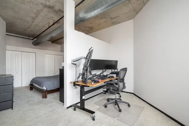 a workspace with furniture and a air conditioner