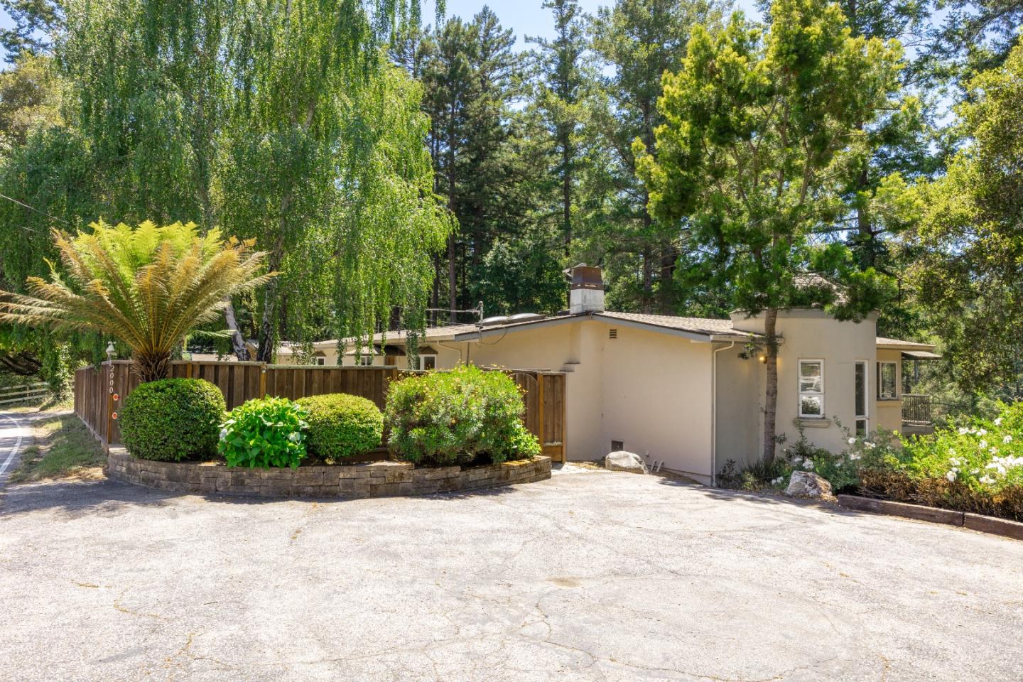 2000 Glen Canyon Road Santa Cruz, CA 95060 - Photo 5 of 41 a front view of a house with a yard and plant