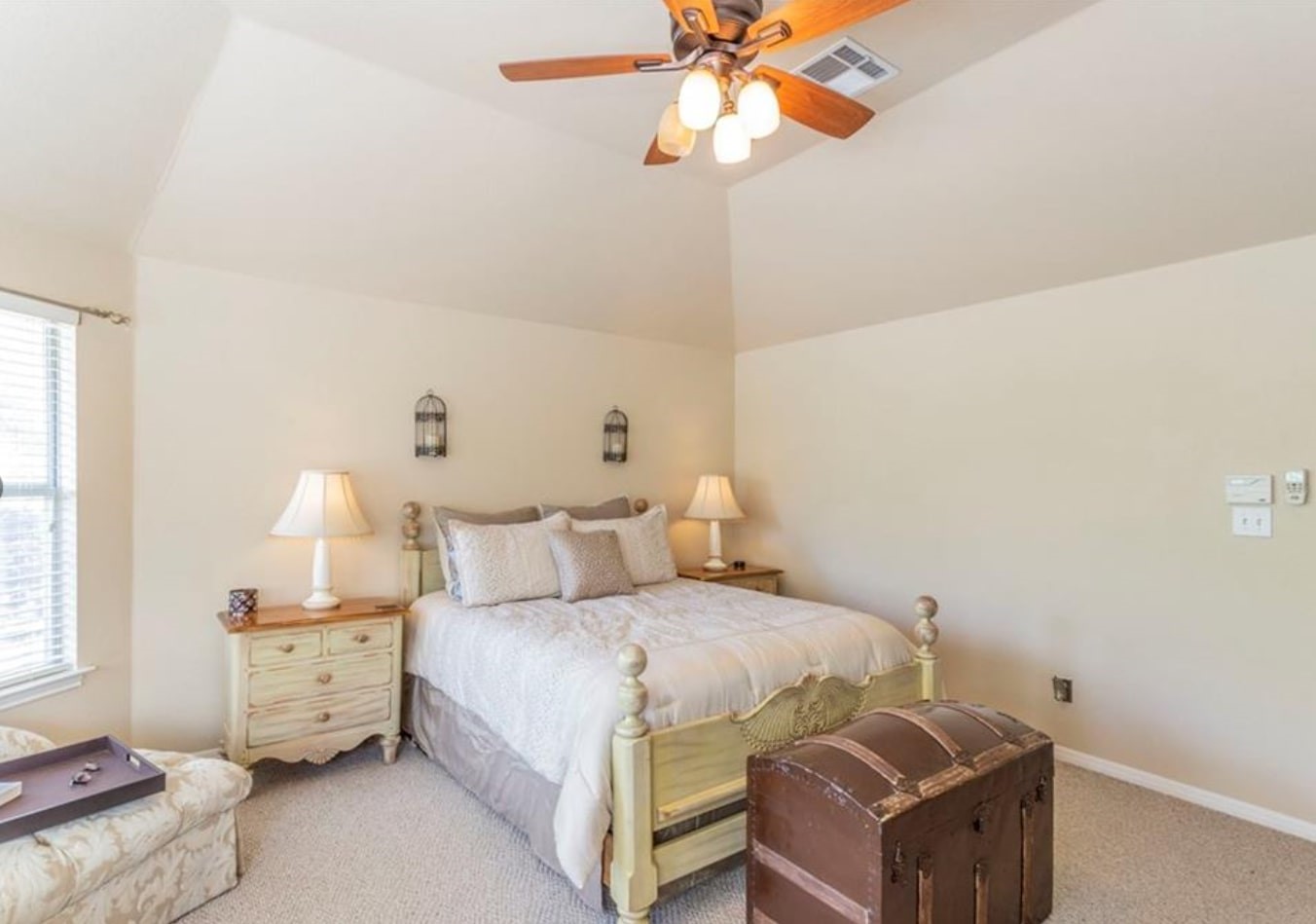 1100 Antelope Ridge Cedar Park, TX 78613 - Photo 13 of 24 a bedroom with a bed and a chandelier