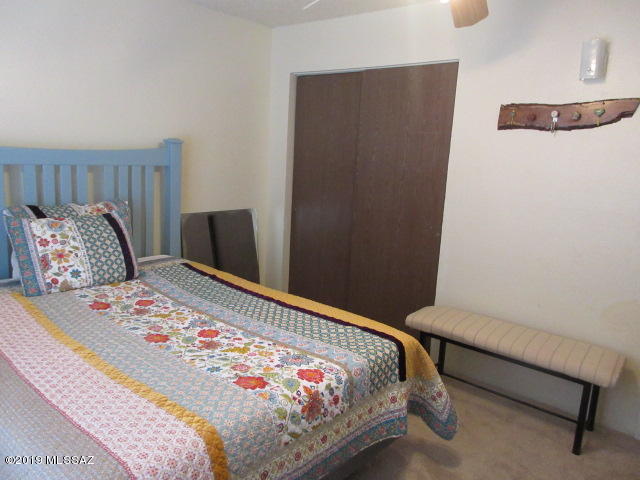 1022 Via Independencia Rio Rico, AZ 85648 - Photo 29 of 41 a bedroom with a bed and a dresser