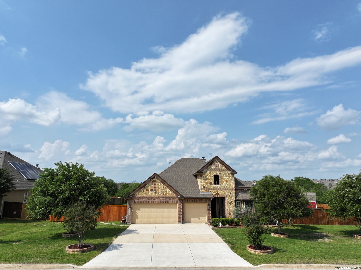 10111 Shallow Bank Converse, TX 78109 - Photo 2 of 65 a front view of a house with a garden