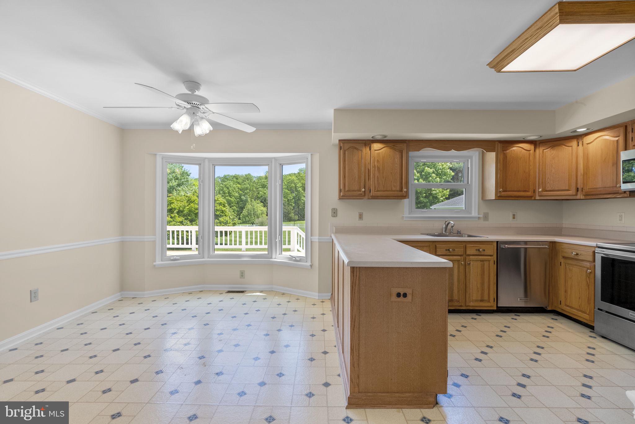 17513 Country View Way Mount Airy, MD 21771 - Photo 19 of 59 a kitchen with a stove a sink and a refrigerator