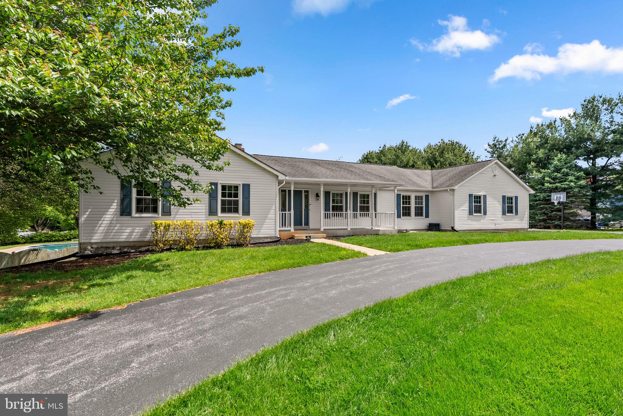 17513 Country View Way Mount Airy, MD 21771 - Photo 2 of 59 a view of house with garden and tall trees
