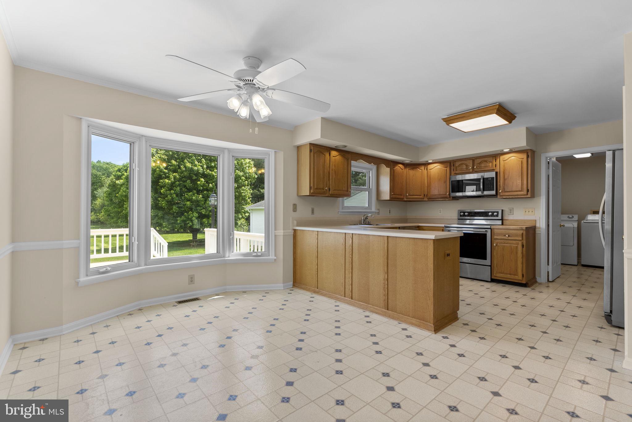 17513 Country View Way Mount Airy, MD 21771 - Photo 21 of 59 a kitchen with stainless steel appliances a refrigerator sink and microwave