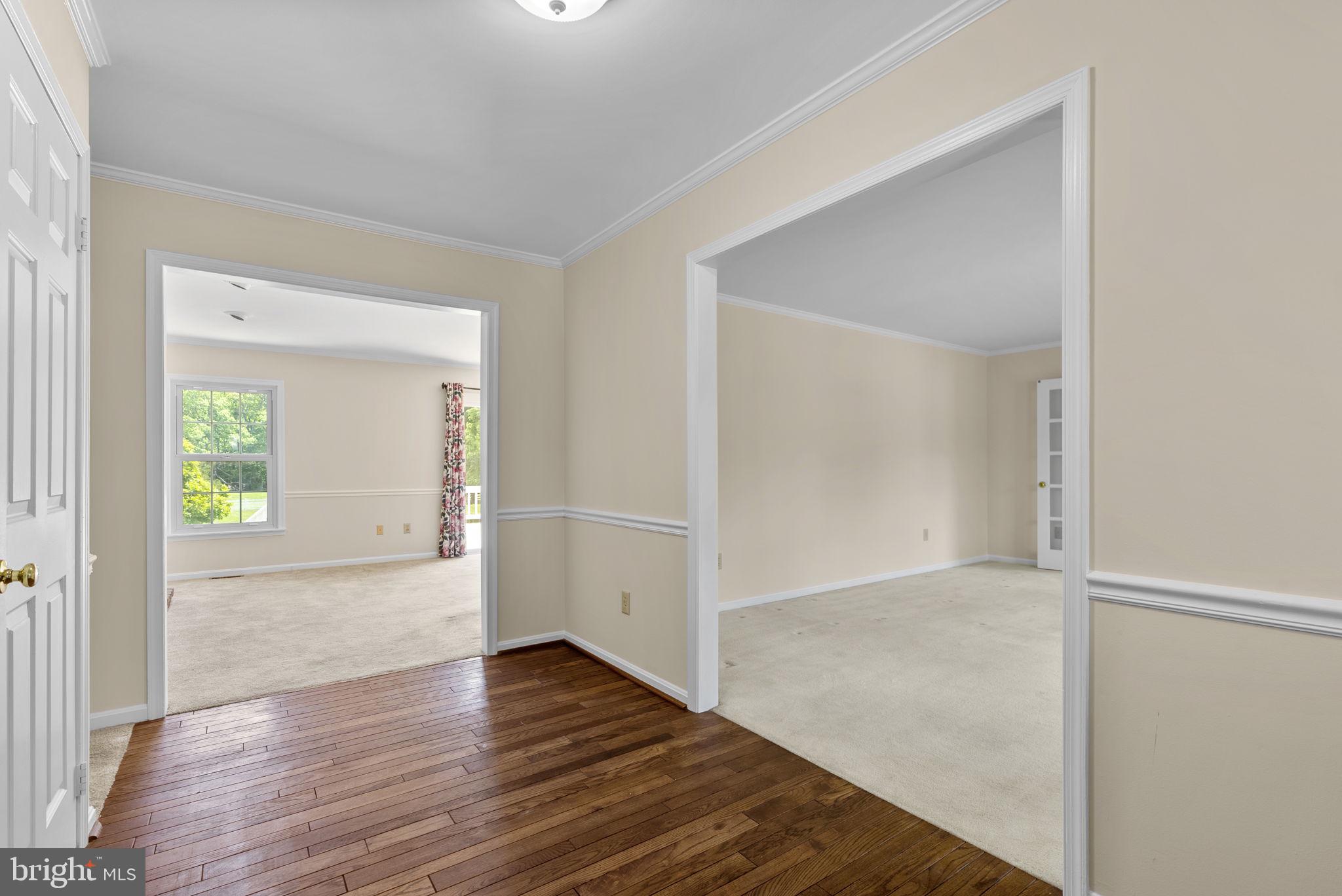 17513 Country View Way Mount Airy, MD 21771 - Photo 9 of 59 an empty room with wooden floor and windows