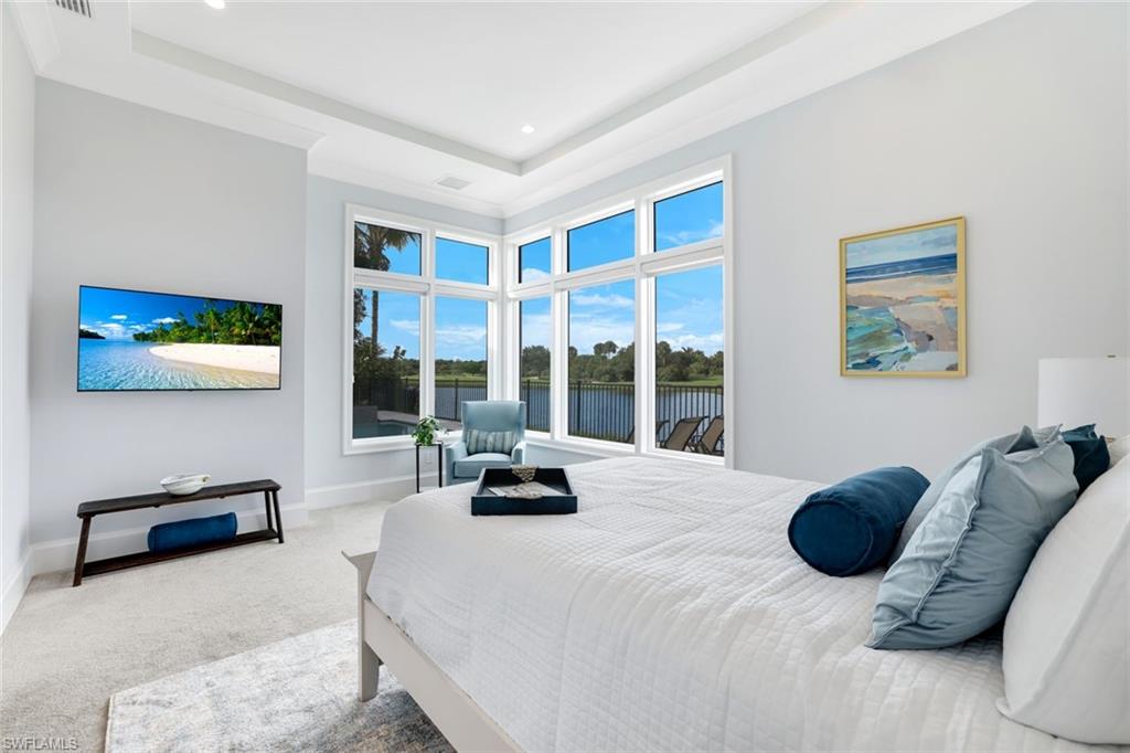 9937 Montiano Court Naples, FL 34113 - Photo 14 of 25 a bedroom with a bed and a large window
