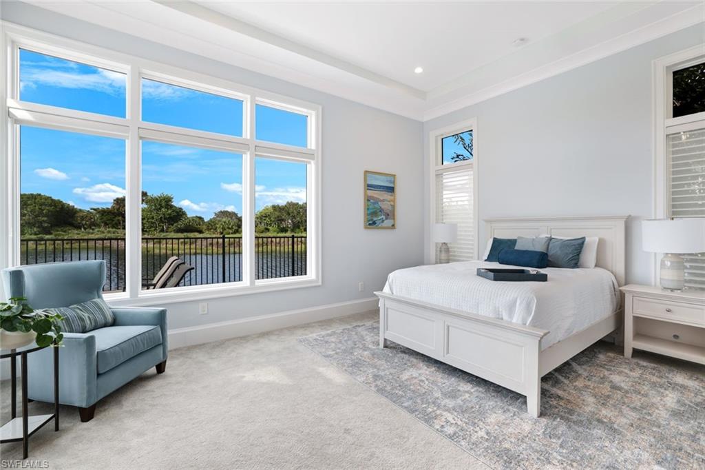 9937 Montiano Court Naples, FL 34113 - Photo 15 of 25 a bedroom with bed and a large window