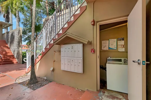 a view of a hallway with staircase