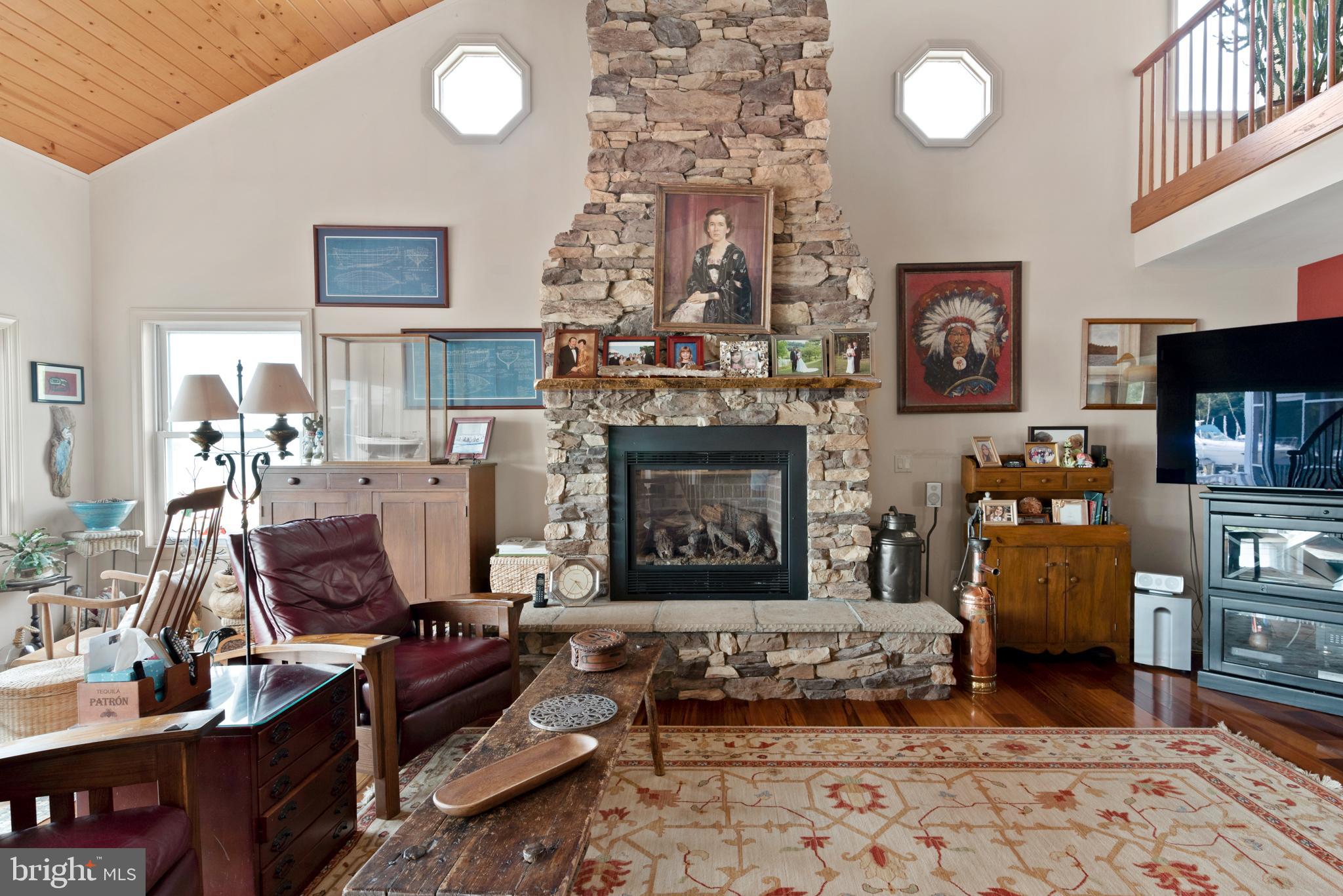 3731 Thomas Point Road Annapolis, MD 21403 - Photo 15 of 90 Vaulted ceiling, stone hearth and gas fireplace
