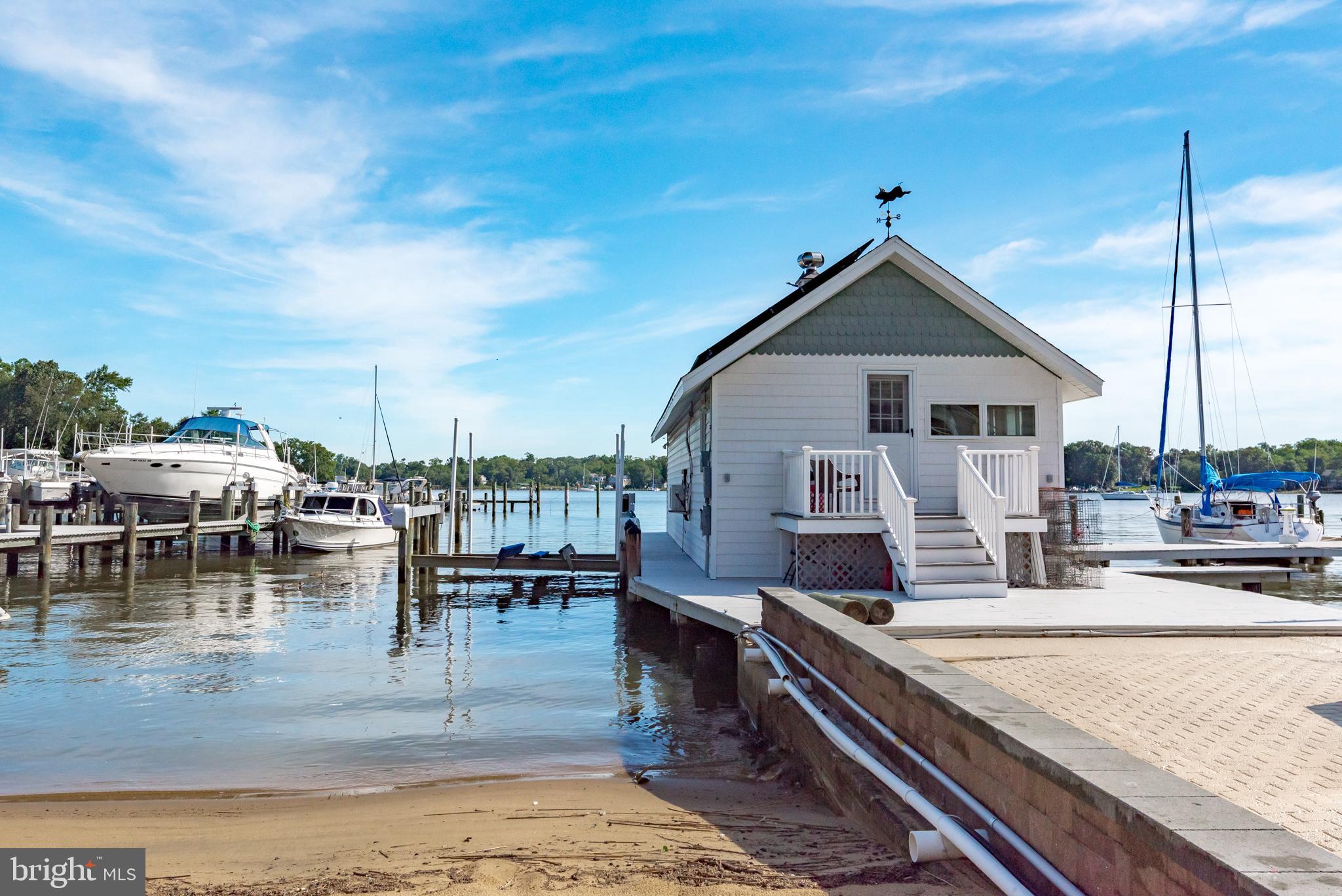 3731 Thomas Point Road Annapolis, MD 21403 - Photo 44 of 90 Sandy beach next to boat house with lifts