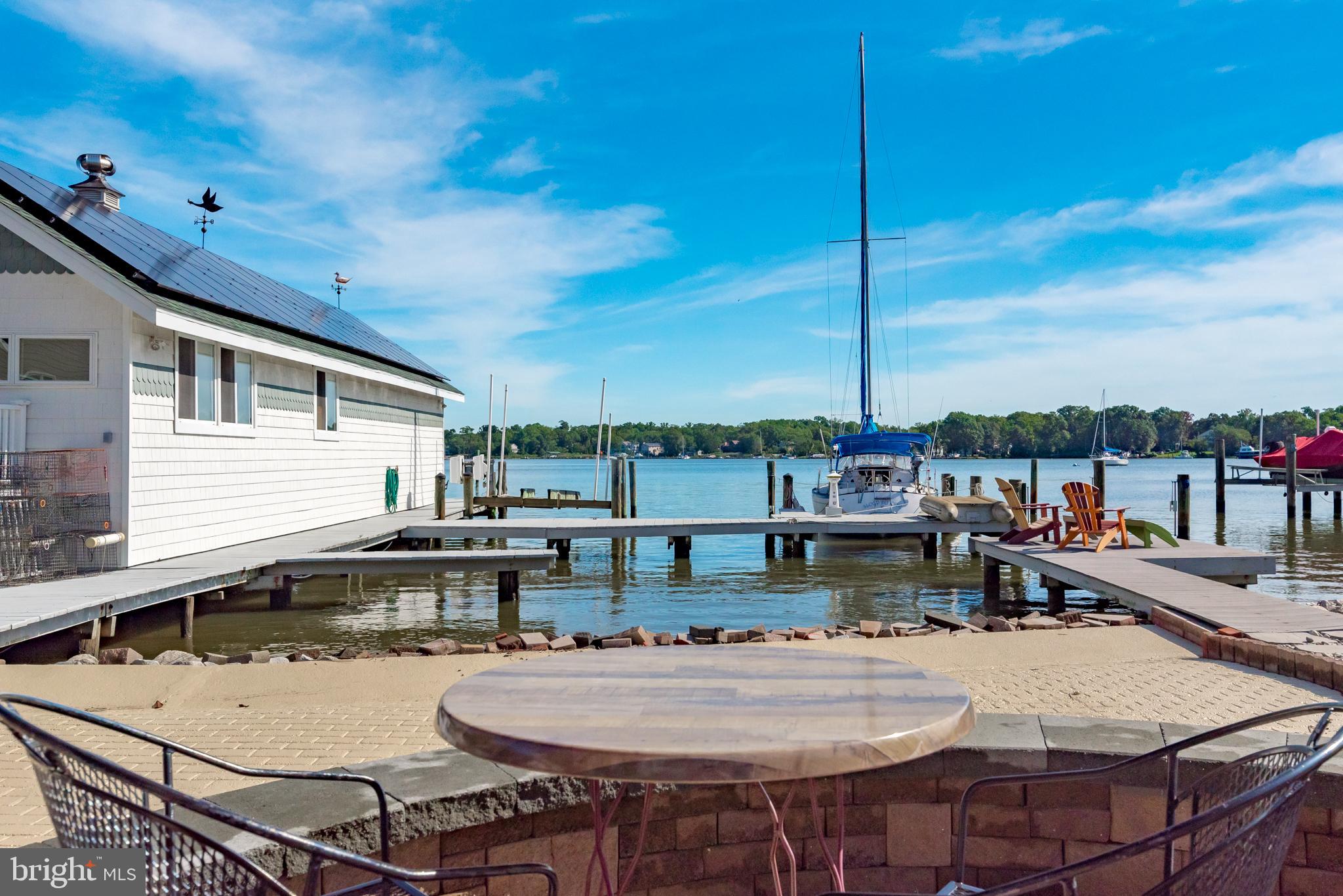 3731 Thomas Point Road Annapolis, MD 21403 - Photo 66 of 90 Deck and knee wall overlooking boathouse and water