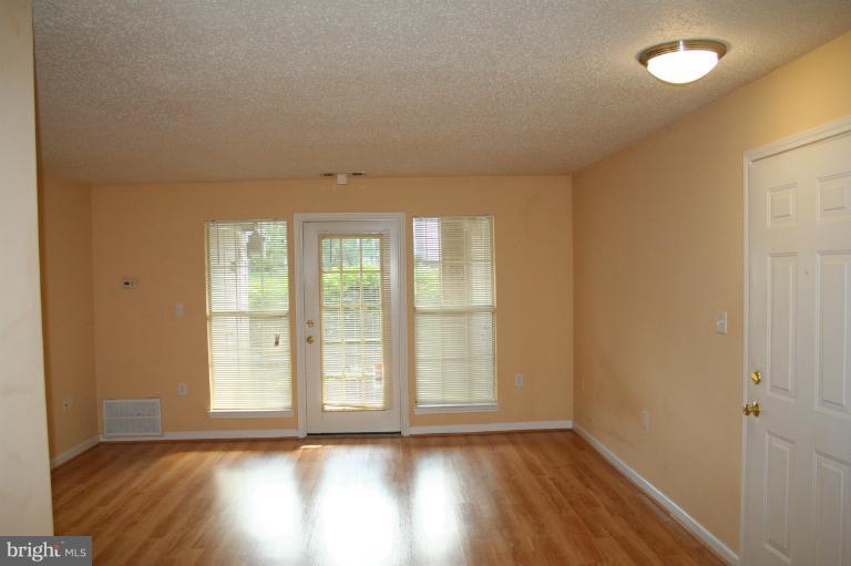 20950 Timber Ridge Terrace, Unit 102 Ashburn, VA 20147 - Photo 6 of 13 Family Room 1