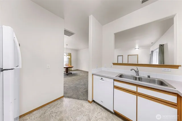 a kitchen with a sink and cabinets