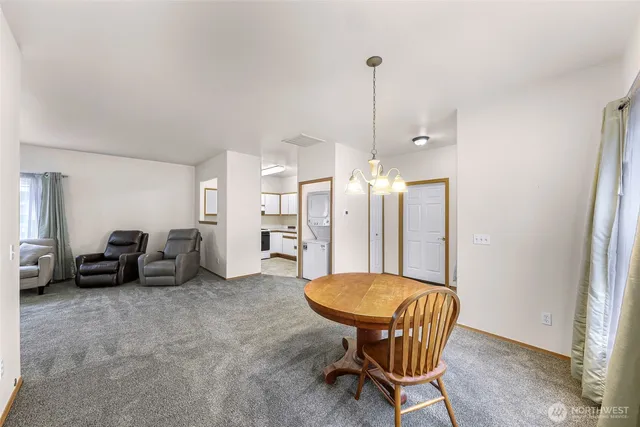 a view of a livingroom with furniture and a ceiling fan