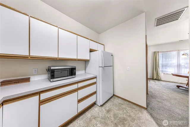 a kitchen with stainless steel appliances a cabinets and a counter top space